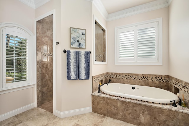 bathroom with plenty of natural light, ornamental molding, and shower with separate bathtub