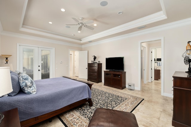 bedroom featuring french doors, a tray ceiling, ceiling fan, and ornamental molding