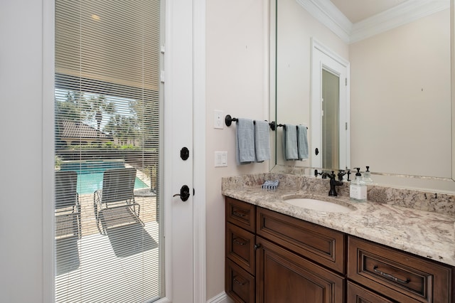 bathroom featuring vanity and ornamental molding