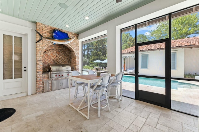 sunroom / solarium featuring wooden ceiling