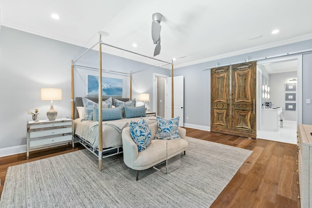 bedroom with ceiling fan, hardwood / wood-style floors, and ornamental molding