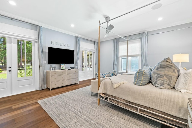 bedroom with multiple windows, french doors, access to outside, and dark hardwood / wood-style floors