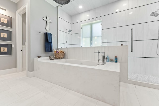 bathroom with crown molding and plus walk in shower