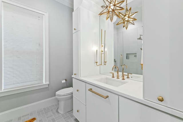 bathroom with tile patterned flooring, vanity, toilet, and an enclosed shower