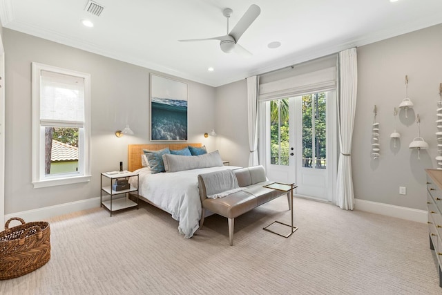 bedroom featuring access to exterior, light colored carpet, and ceiling fan