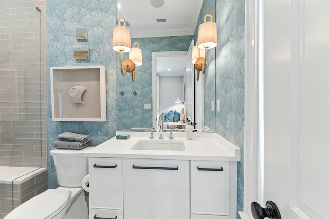 bathroom with a shower, vanity, toilet, and crown molding