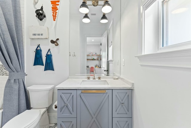 bathroom featuring vanity and toilet