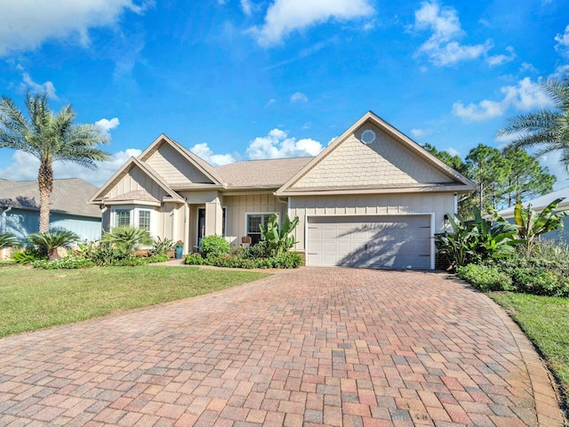 view of front facade with a front lawn and a garage