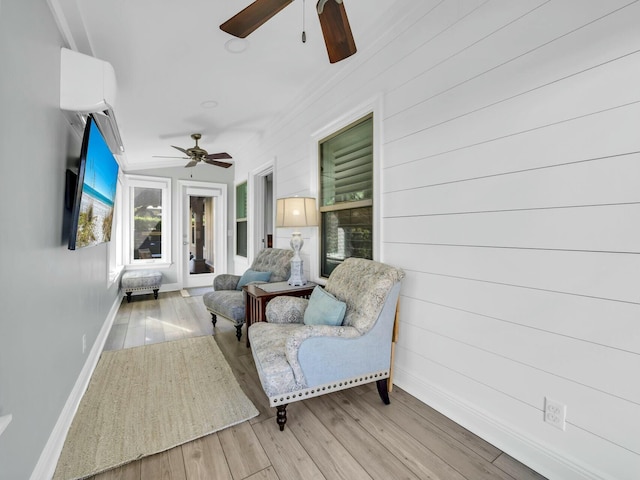 interior space with ceiling fan