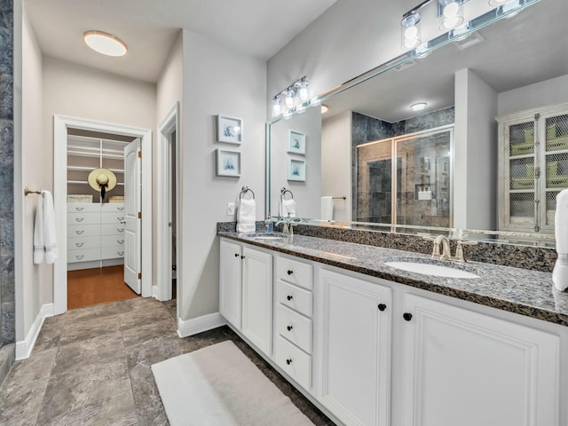 bathroom with vanity and walk in shower