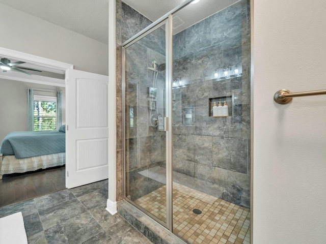 bathroom with ceiling fan and walk in shower