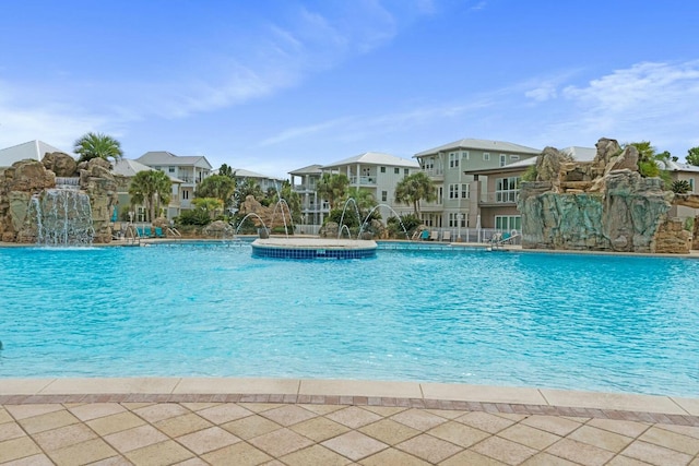 view of pool with pool water feature