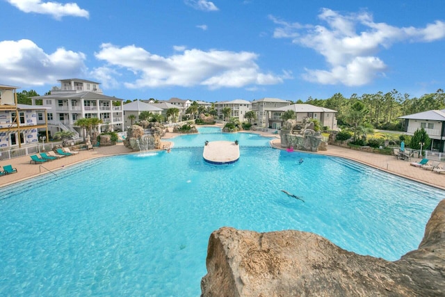 view of pool featuring a patio and pool water feature