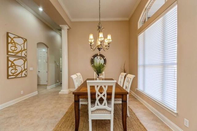 dining area featuring decorative columns, baseboards, an inviting chandelier, and ornamental molding