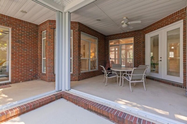 view of patio with outdoor dining space and ceiling fan