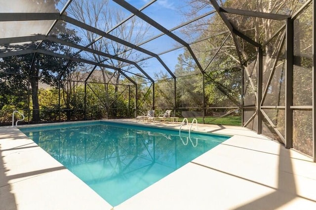 pool with a patio and a lanai