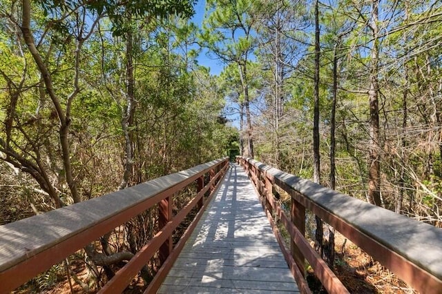 view of home's community with a wooded view