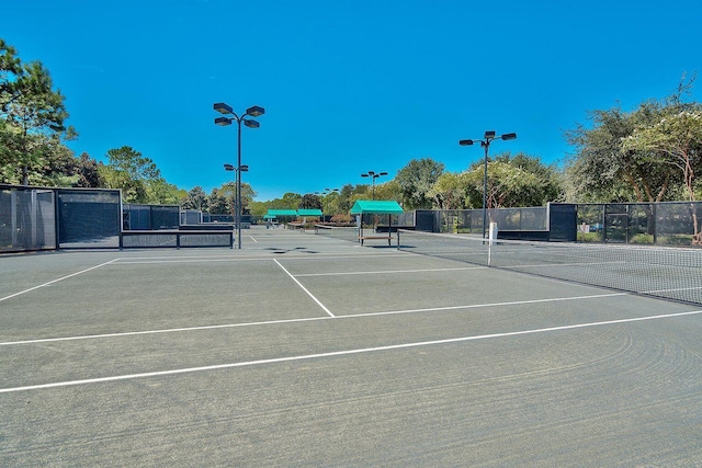 view of sport court with fence