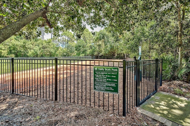 view of gate featuring fence