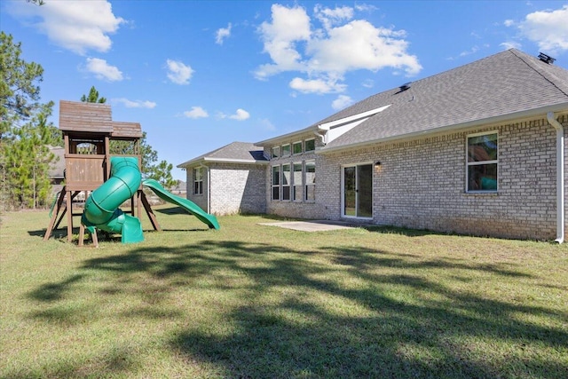 view of playground with a yard