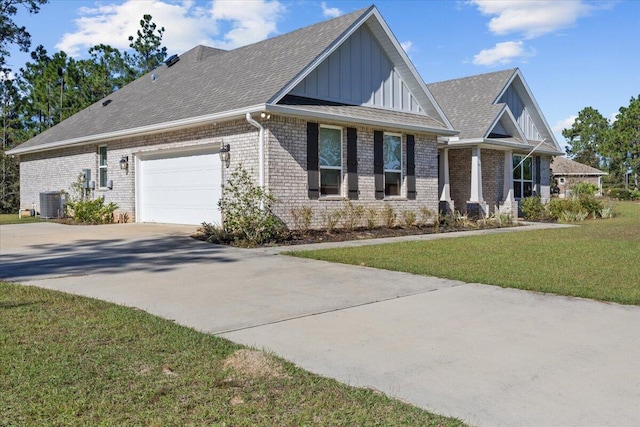 view of property exterior with a lawn, central air condition unit, and a garage