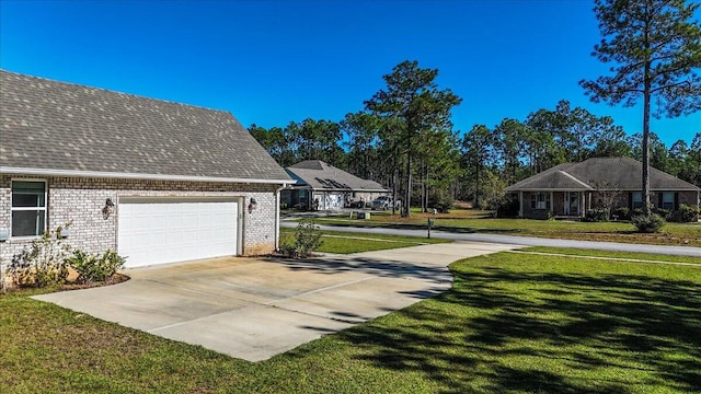 view of side of home with a yard