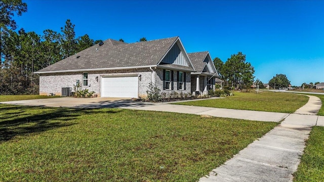 view of side of home with a garage, central AC unit, and a lawn