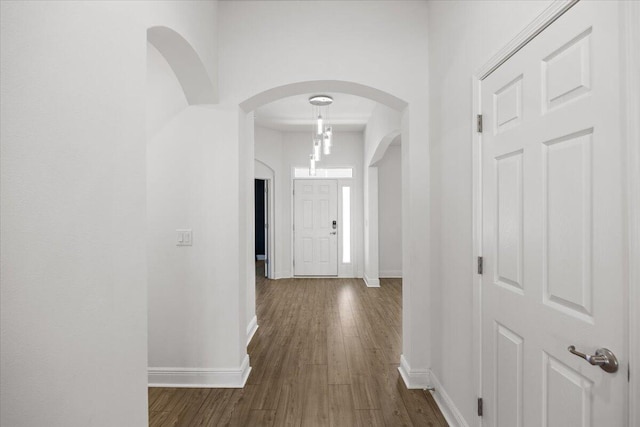 hall with dark hardwood / wood-style floors