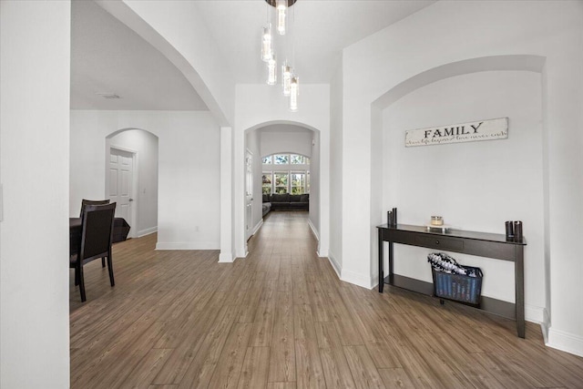 hall with hardwood / wood-style floors