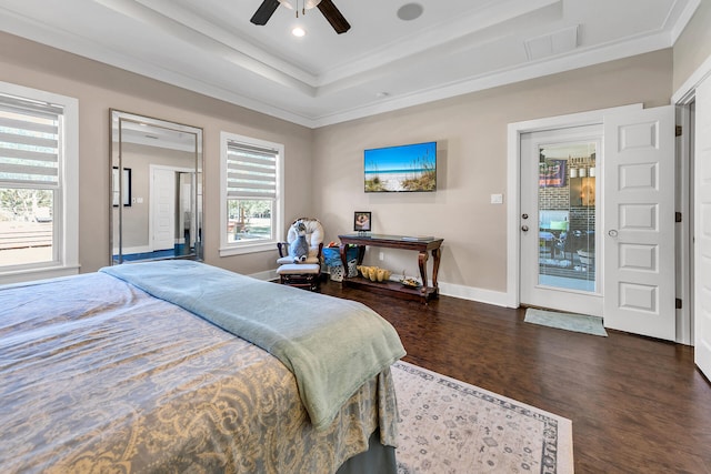 bedroom featuring ceiling fan, dark wood-type flooring, a tray ceiling, access to outside, and ornamental molding