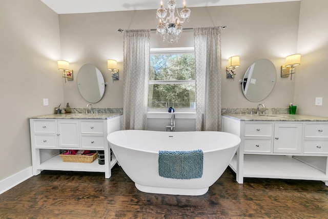 bathroom featuring vanity and a bath