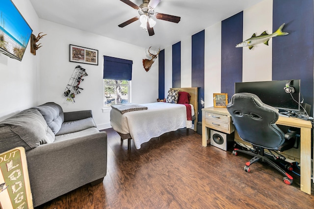 bedroom featuring dark hardwood / wood-style floors and ceiling fan