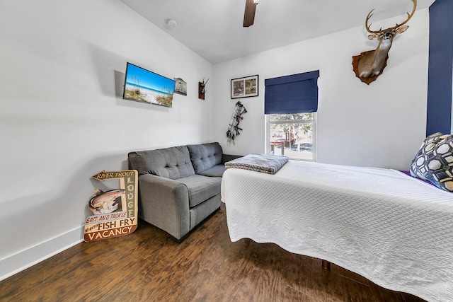 bedroom with ceiling fan and dark hardwood / wood-style flooring