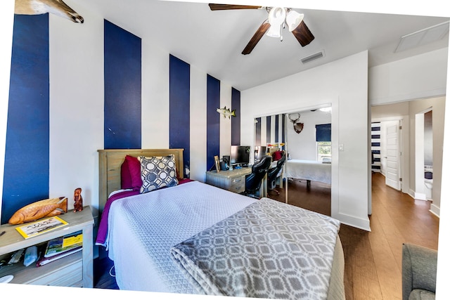 bedroom featuring ceiling fan and dark wood-type flooring