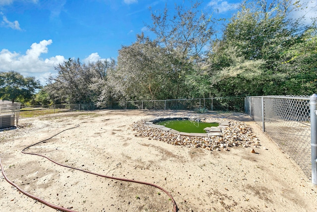 view of yard featuring central AC unit