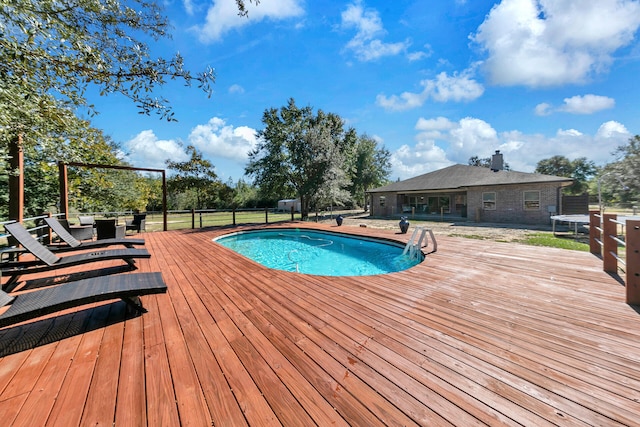 view of pool featuring a deck and a trampoline