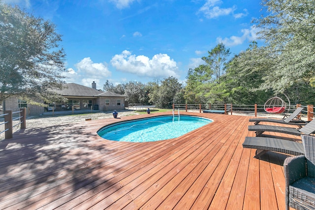 view of pool with a deck