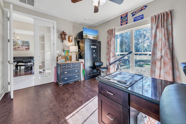 office area with dark hardwood / wood-style floors and ceiling fan with notable chandelier