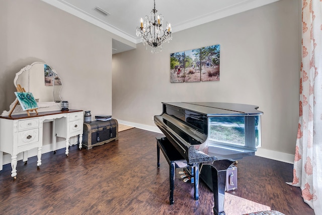 misc room featuring a chandelier, crown molding, and dark wood-type flooring