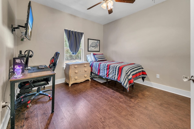 bedroom featuring ceiling fan and dark wood-type flooring