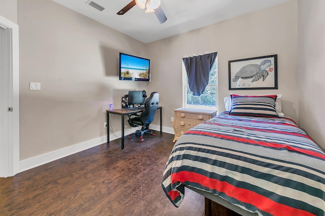 bedroom featuring dark hardwood / wood-style flooring and ceiling fan