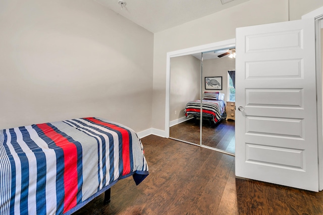 bedroom featuring dark hardwood / wood-style flooring and a closet