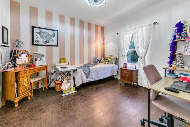 bedroom with dark hardwood / wood-style floors