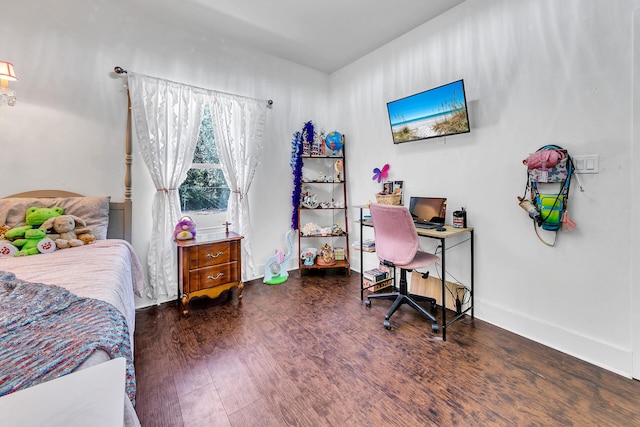 bedroom featuring dark hardwood / wood-style flooring