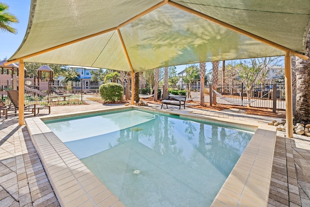 view of pool with a playground