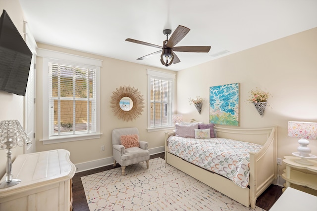 bedroom with ceiling fan and light hardwood / wood-style flooring