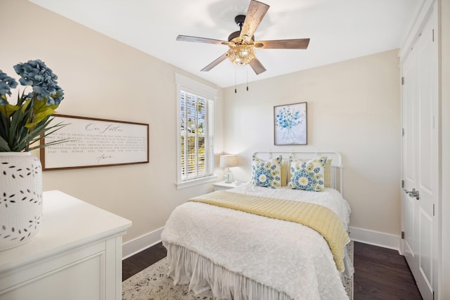 bedroom featuring ceiling fan, a closet, and hardwood / wood-style flooring