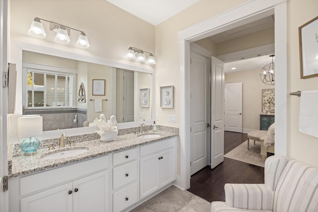 bathroom with wood-type flooring and vanity