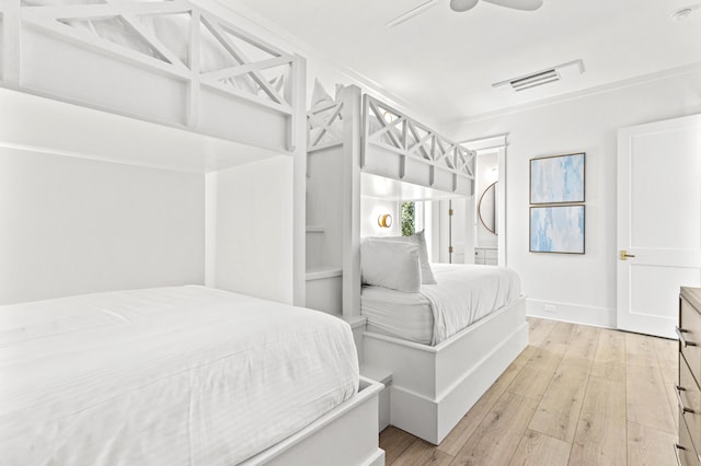 bedroom with ceiling fan and light wood-type flooring