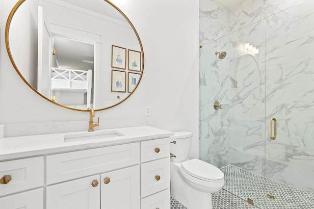 bathroom with a shower with door, vanity, and toilet